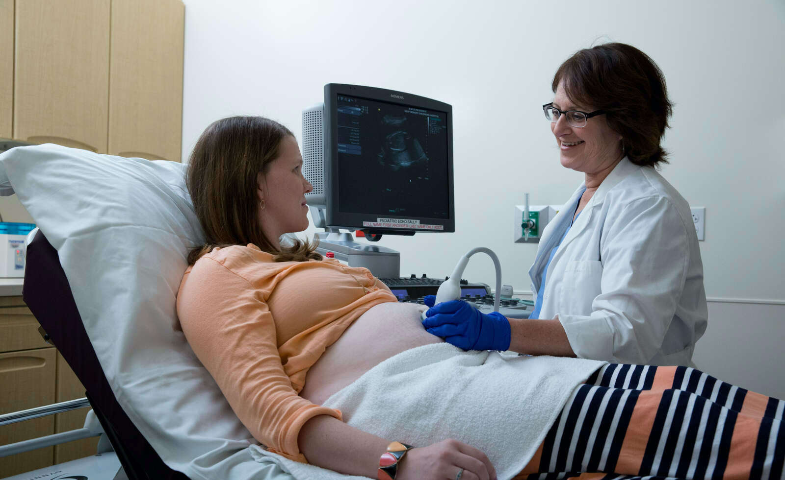 Dr. Roberta Keller performing ultrasound on a patient